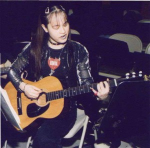 Cherry Teresa playing guitar, teenage years